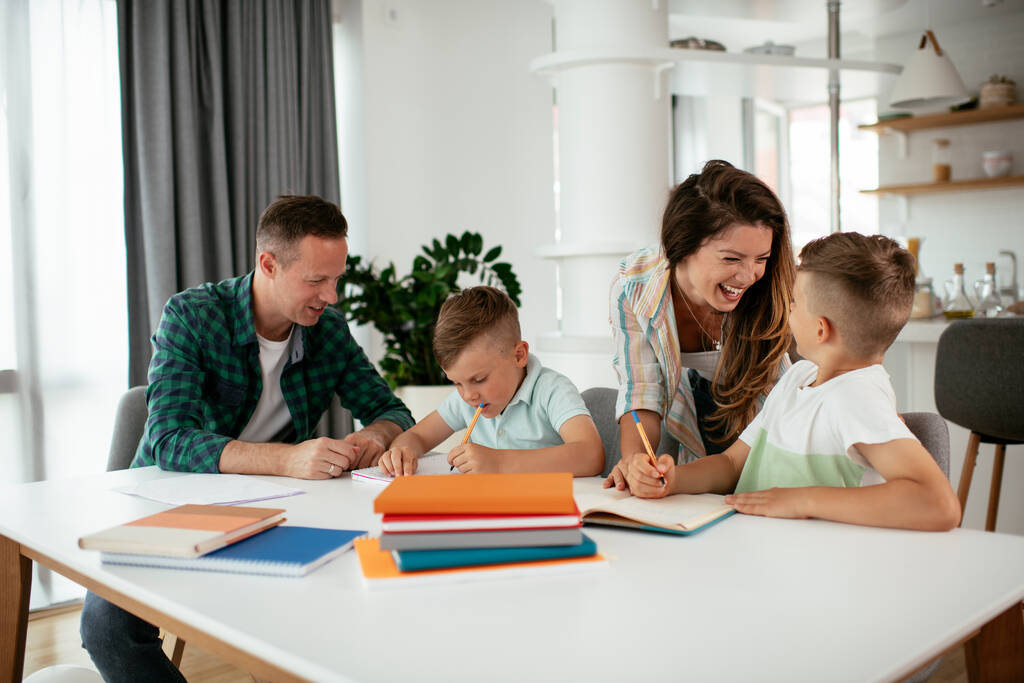 stock photo parents helping kids homework little boys learning home